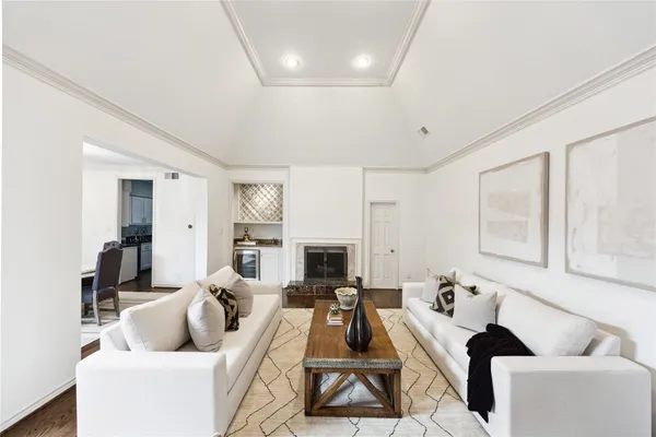 a living room with furniture fireplace and a fireplace