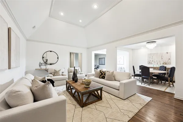 a living room with couch a table and a large window