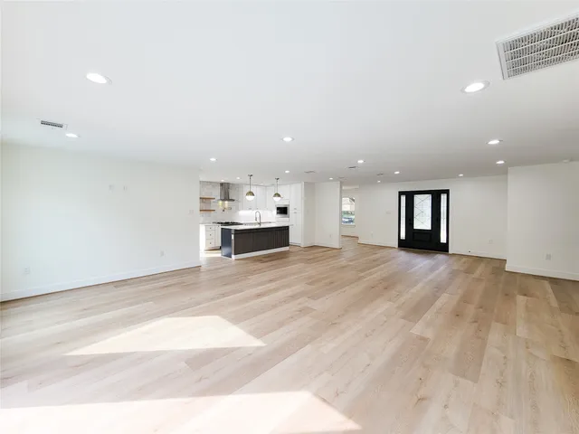 a kitchen with counter top space cabinets and appliances