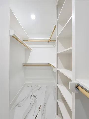 a view of an empty walk in closet