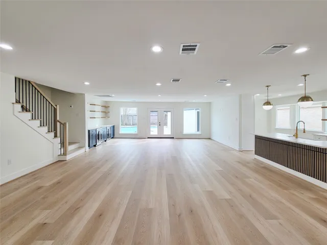 a view of kitchen and kitchen with furniture wooden floor and window