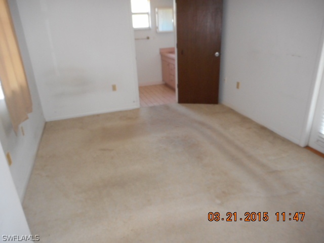 107 Davis Road Lehigh Acres, FL 33936 - Photo 7 of 9 a view of an empty room