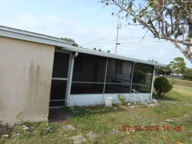 107 Davis Road Lehigh Acres, FL 33936 - Photo 9 of 9 a backyard of a house