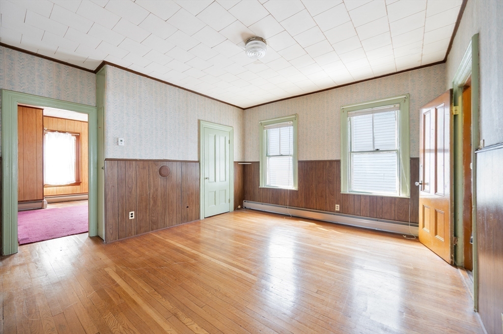 545 2nd Street Fall River, MA 02721 - Photo 12 of 22 a view of empty room with wooden floor and fan