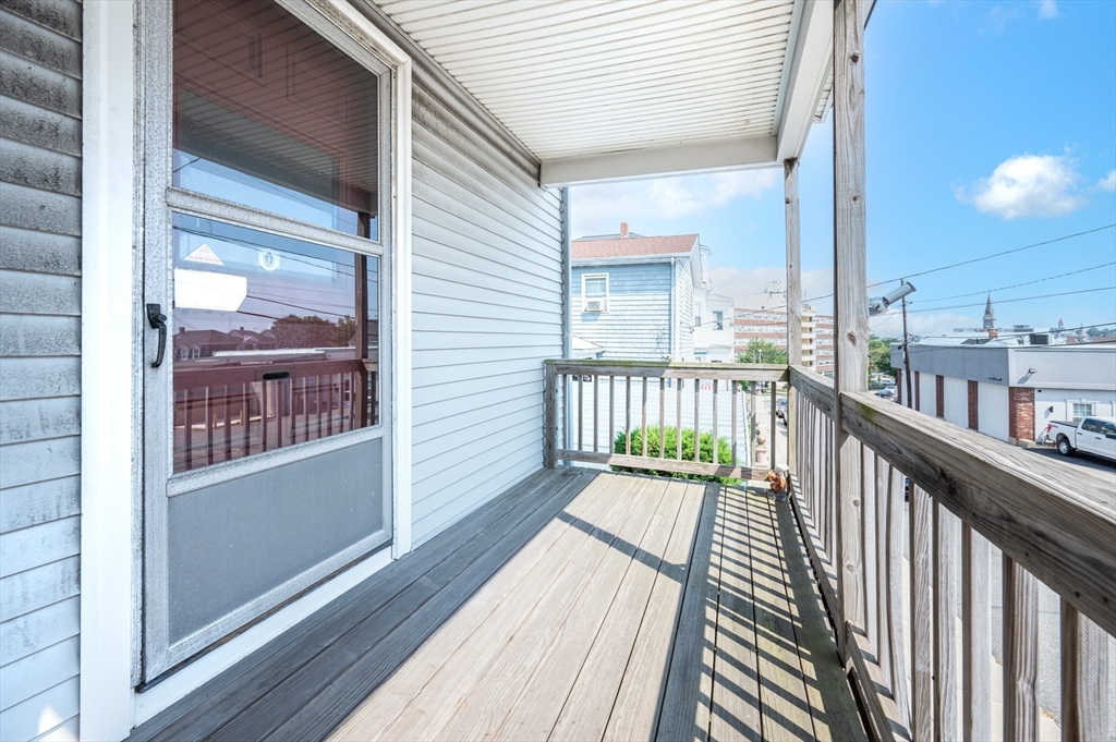 545 2nd Street Fall River, MA 02721 - Photo 3 of 22 a view of a balcony with wooden floor