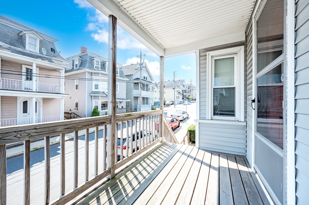 545 2nd Street Fall River, MA 02721 - Photo 4 of 22 a view of a balcony with wooden floor