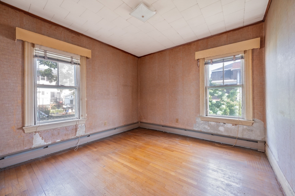 545 2nd Street Fall River, MA 02721 - Photo 8 of 22 an empty room with a window
