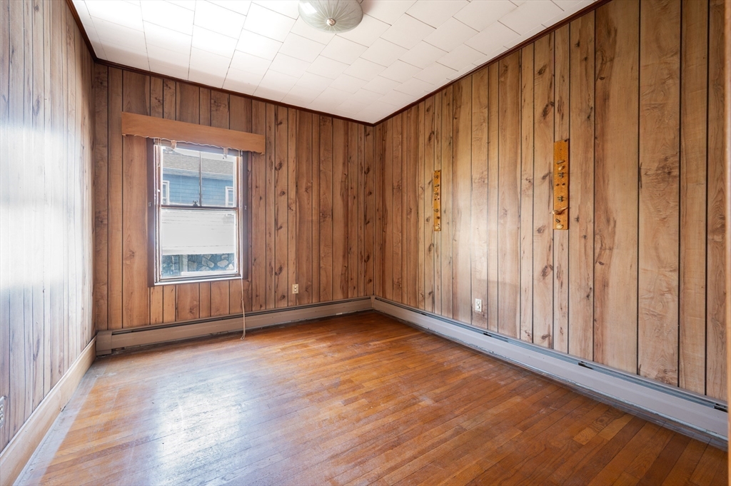545 2nd Street Fall River, MA 02721 - Photo 9 of 22 a view of an empty room with wooden floor