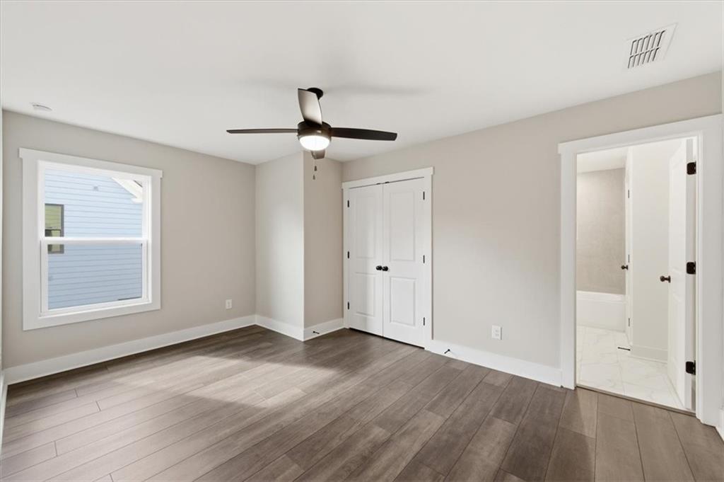 139 Old Alabama Road Southeast Emerson, GA 30137 - Photo 36 of 50 a view of an empty room with wooden floor and a window