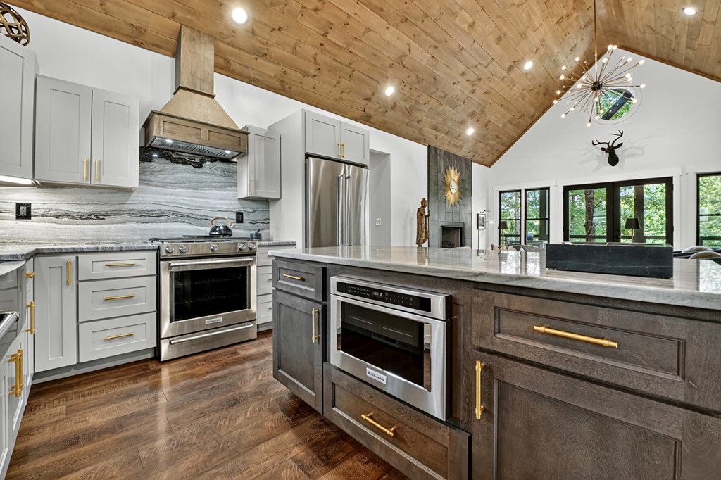 141 Long View Lane Blue Ridge, GA 30513 - Photo 11 of 61 a kitchen with stainless steel appliances granite countertop a stove and a sink