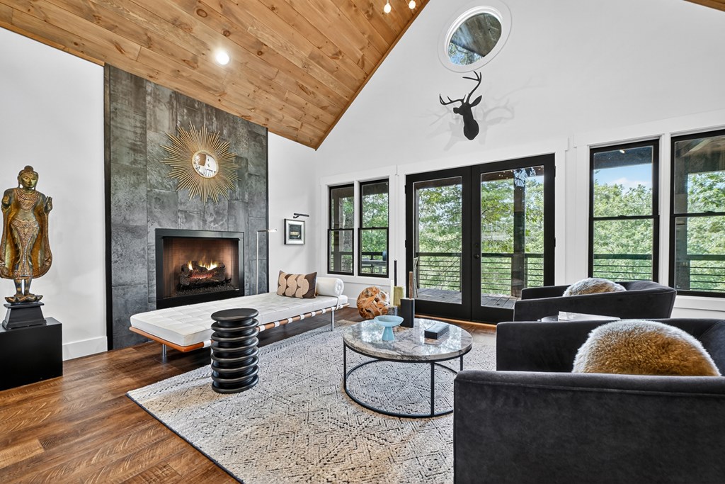 141 Long View Lane Blue Ridge, GA 30513 - Photo 21 of 61 a living room with fireplace furniture and a large window