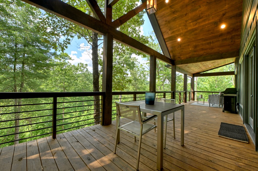 141 Long View Lane Blue Ridge, GA 30513 - Photo 25 of 61 a view of a balcony with wooden floor and outdoor seating
