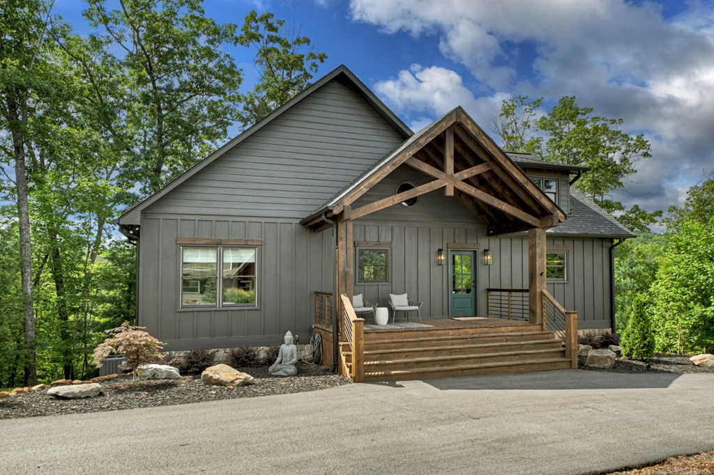 141 Long View Lane Blue Ridge, GA 30513 - Photo 3 of 61 a front view of a house with a garden