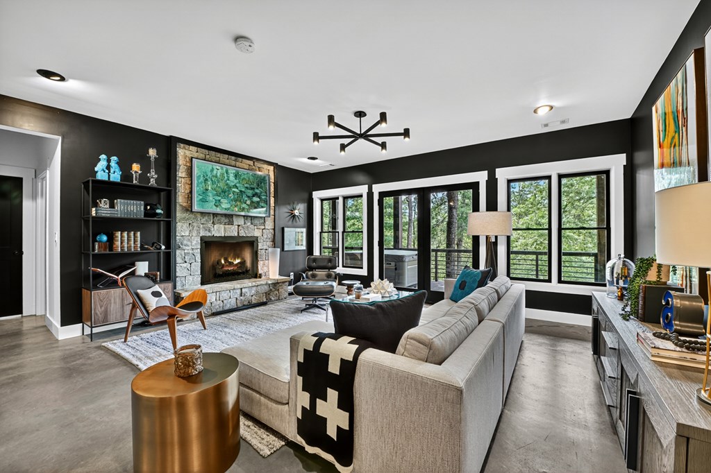 141 Long View Lane Blue Ridge, GA 30513 - Photo 39 of 61 a living room with furniture a floor to ceiling window and a flat screen tv