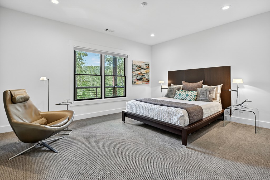 141 Long View Lane Blue Ridge, GA 30513 - Photo 45 of 61 a bedroom with a bed and glass windows