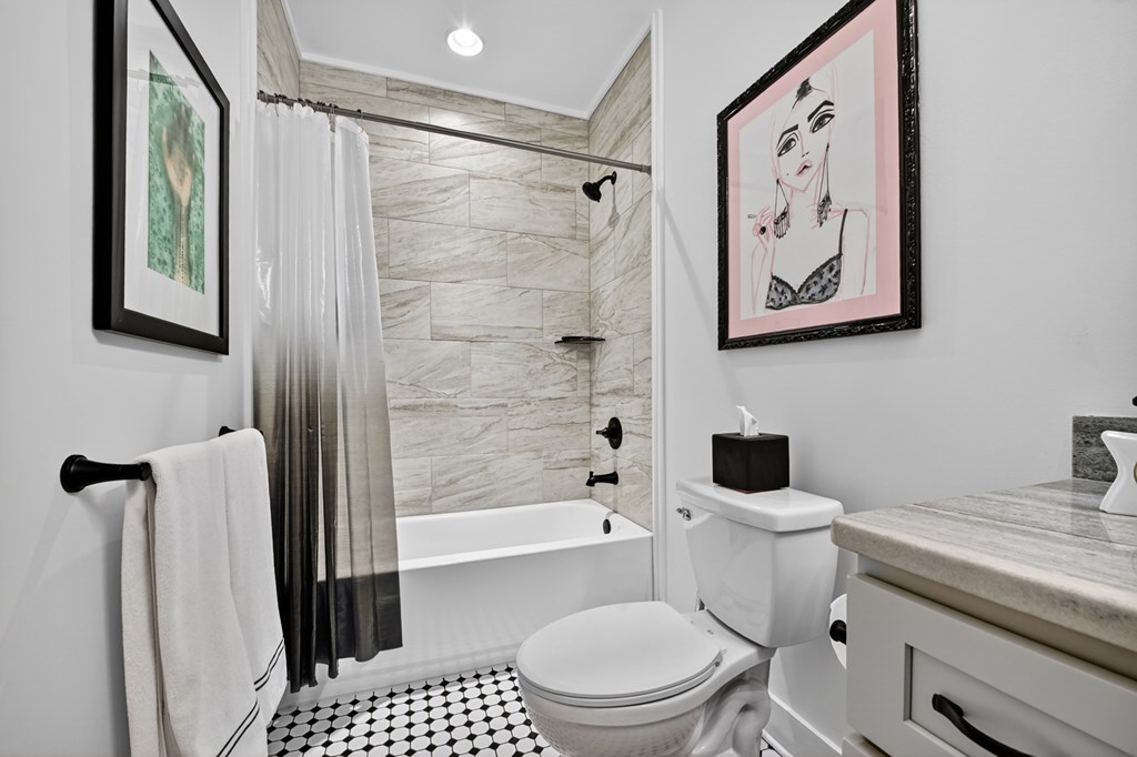 141 Long View Lane Blue Ridge, GA 30513 - Photo 47 of 61 a bathroom with a toilet and a shower curtain