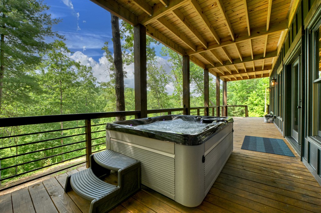 141 Long View Lane Blue Ridge, GA 30513 - Photo 51 of 61 a view of a balcony with chairs and wooden floor