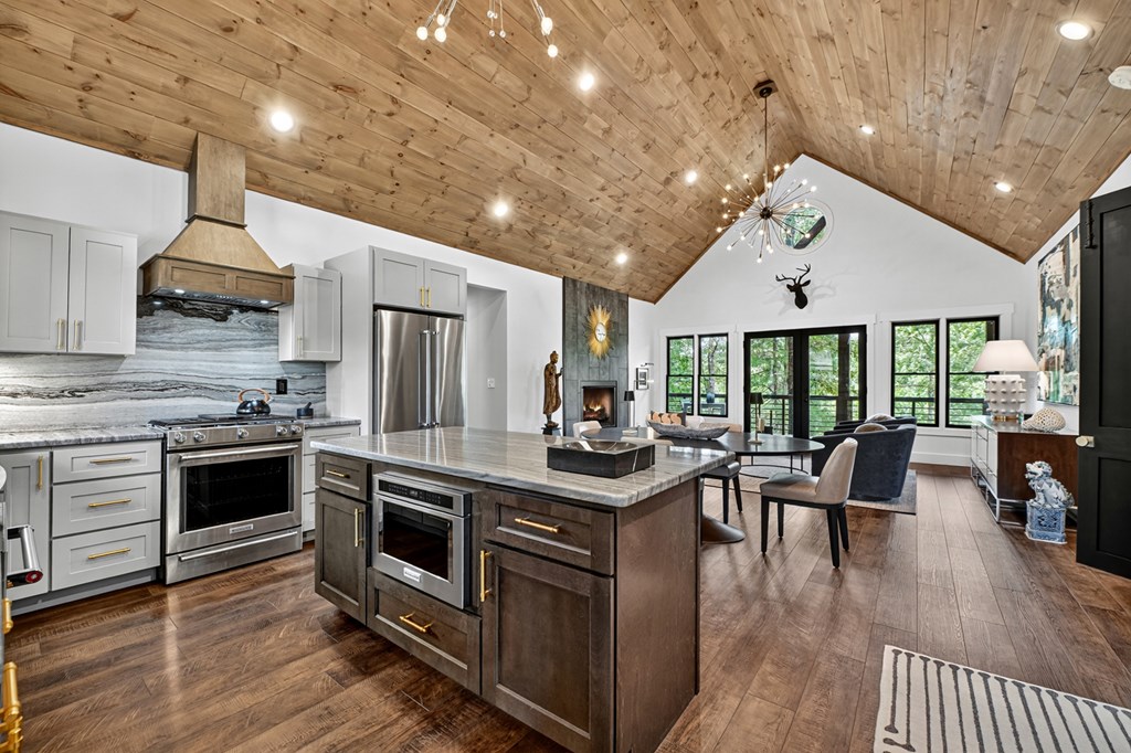 141 Long View Lane Blue Ridge, GA 30513 - Photo 7 of 61 a kitchen with stainless steel appliances granite countertop a stove and cabinets