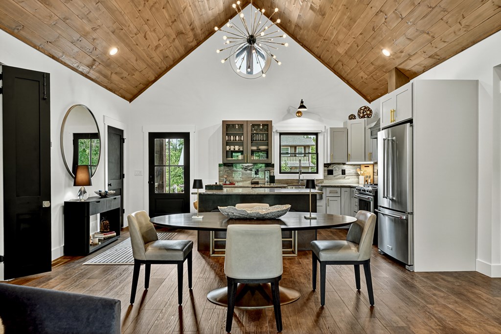 141 Long View Lane Blue Ridge, GA 30513 - Photo 8 of 61 a kitchen with stainless steel appliances granite countertop a dining table chairs refrigerator and sink