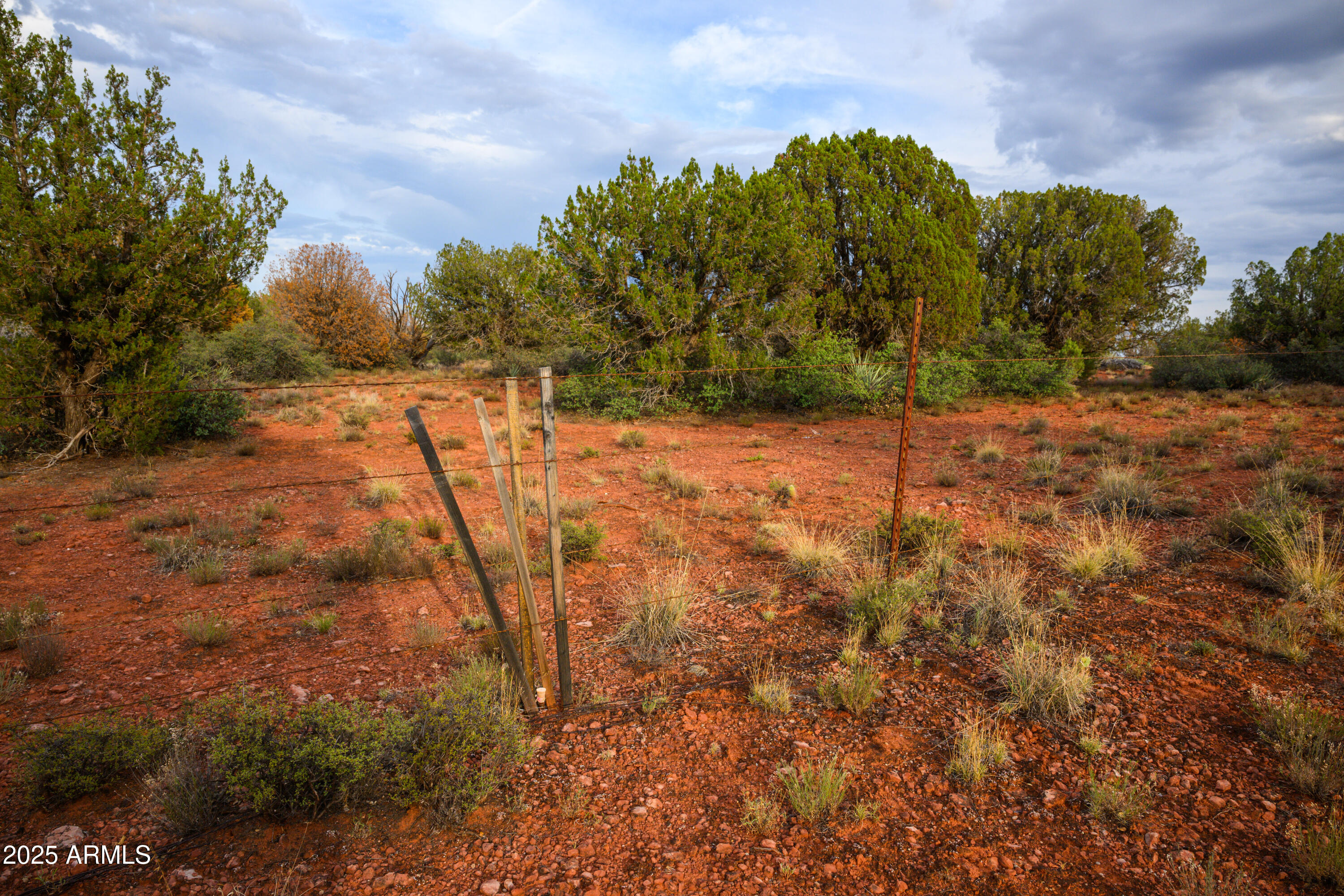 55 Estrella Road, Unit 5 Sedona, AZ 86336 - Photo 25 of 61 a view of a yard with trees in the background