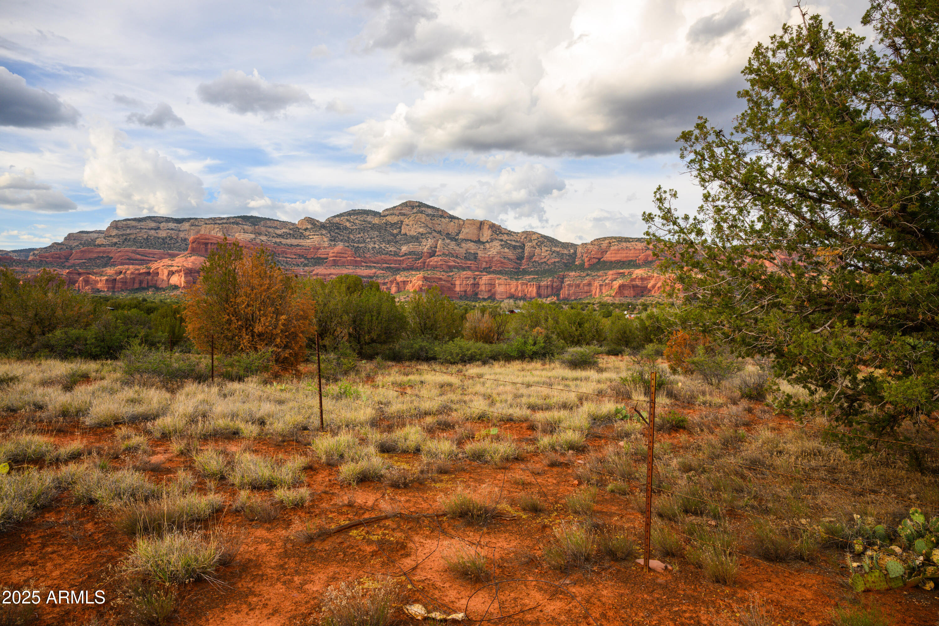 55 Estrella Road, Unit 5 Sedona, AZ 86336 - Photo 30 of 61 a view of a lake with mountains in the background