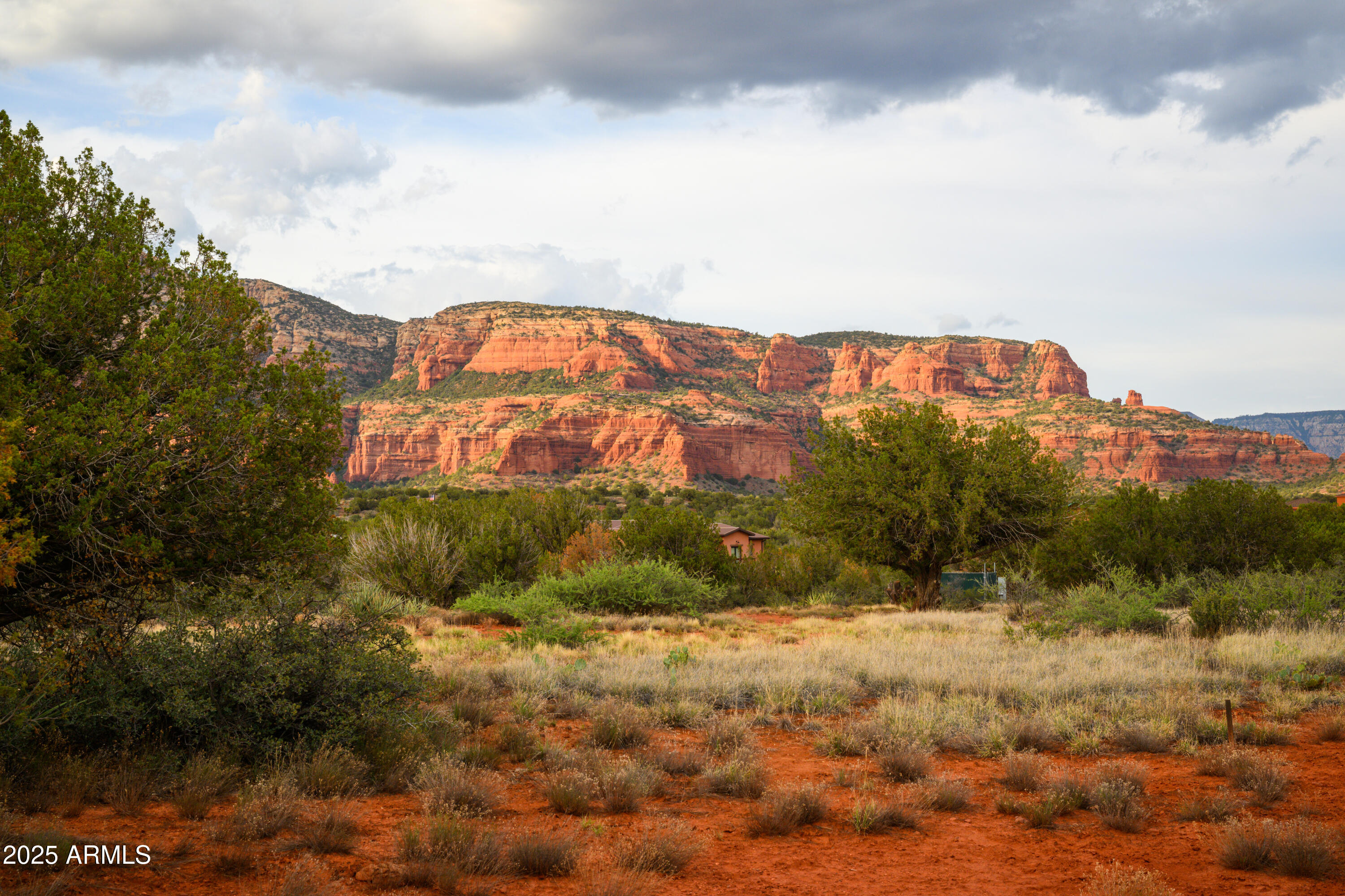 55 Estrella Road, Unit 5 Sedona, AZ 86336 - Photo 35 of 61 a view of a large building with mountains in the background