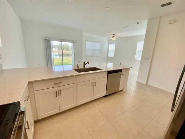a kitchen with a sink and cabinets