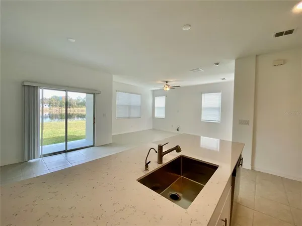 a kitchen with a stove a sink and a refrigerator