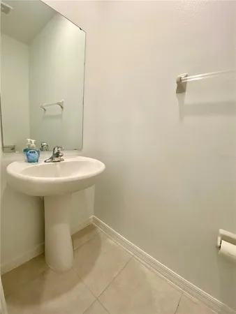 a bathroom with a sink a mirror and a toilet