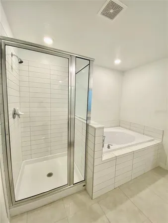a bathroom with a shower and a tub