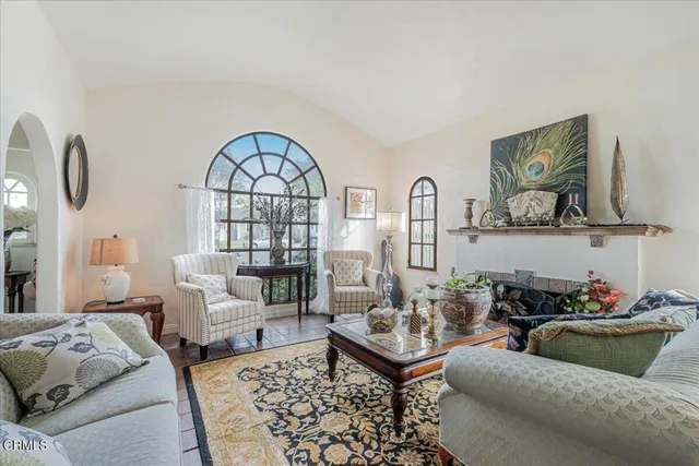a view of a hallway with wooden floor and front door