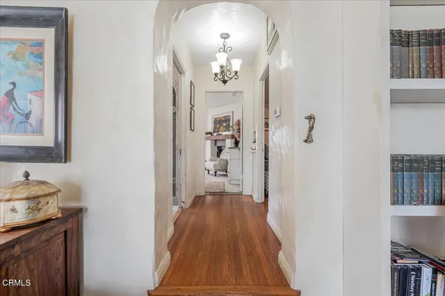 a view of a dining room with furniture and chandelier