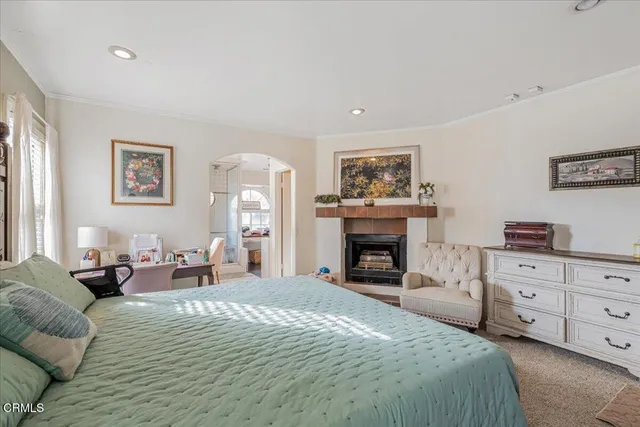 a room with furniture a rug toys and a view of bathroom