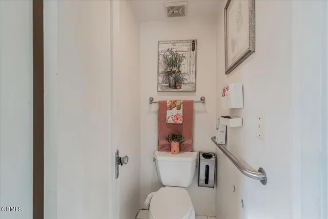 a view of a patio with table and chairs and potted plants
