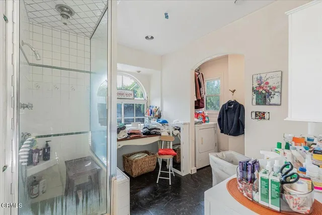 a view of a house with pool and chairs