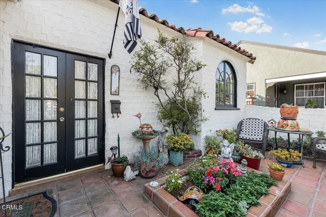 a view of living room with furniture and flowers