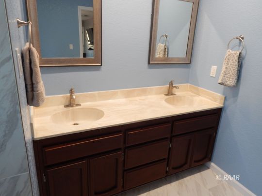 517 Suzanne Street Ridgecrest, CA 93555 - Photo 14 of 34 a bathroom with a sink and a mirror