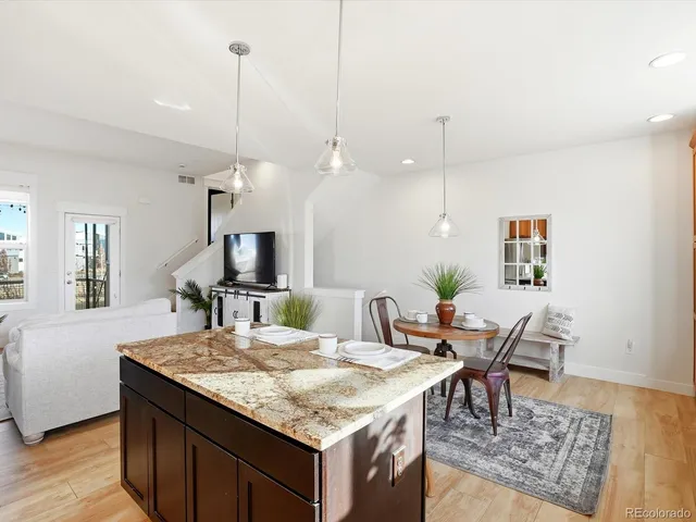 a kitchen with a table and chairs in it