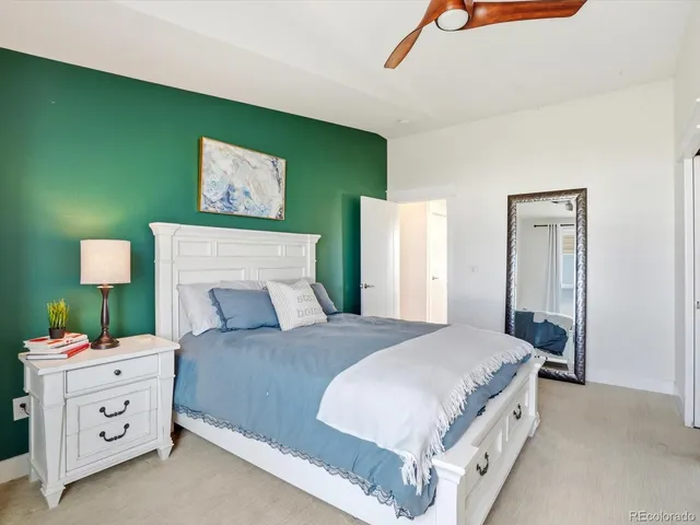 a bedroom with a bed and a dresser