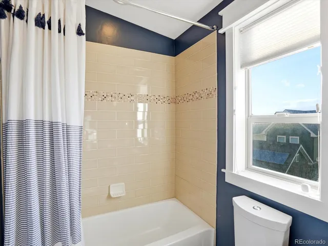 a bathroom with a shower and a tub