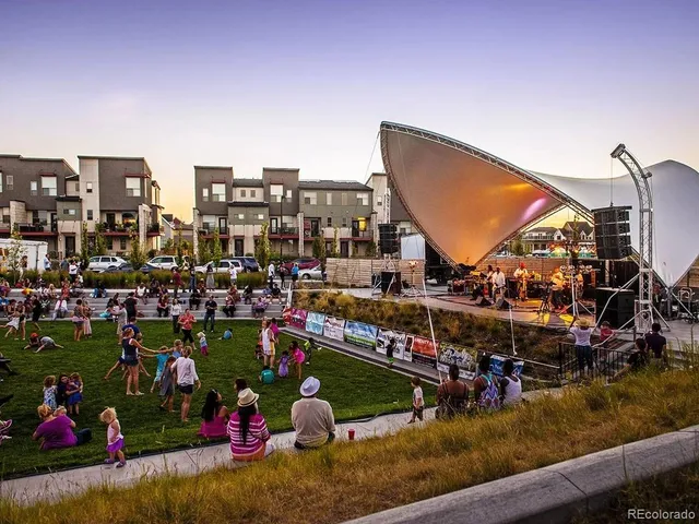 an aerial view of residential building and lake