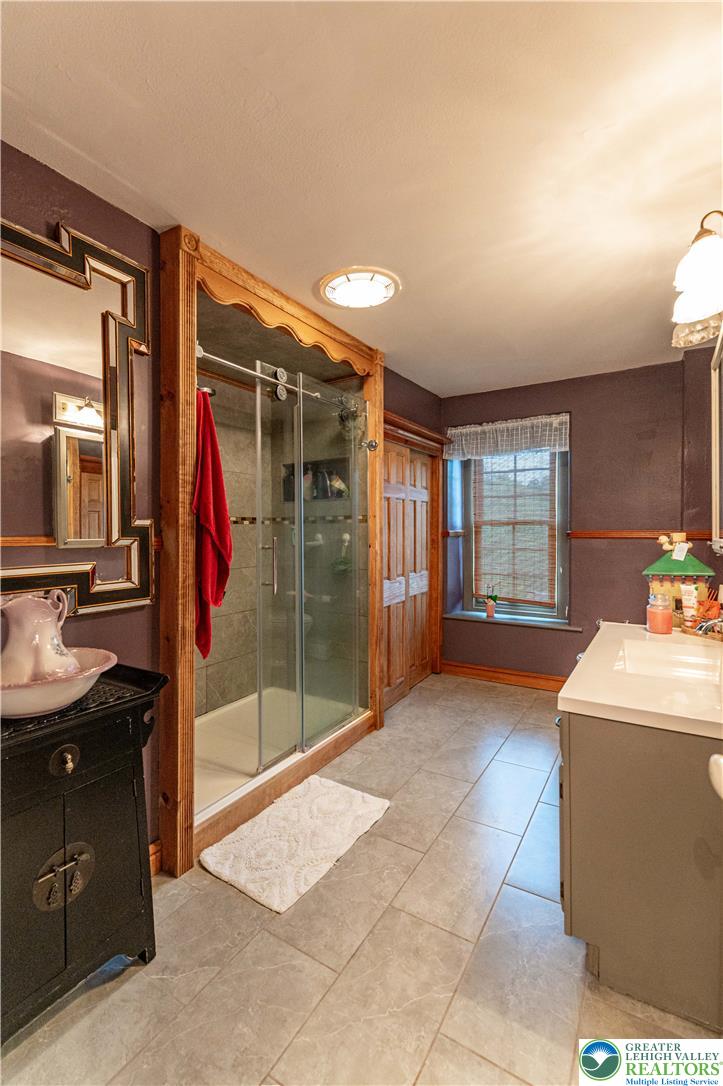 2485 Hieter Road Quakertown, PA 18951 - Photo 46 of 97 A well-lit bathroom featuring a spacious walk-in shower and ample vanity space.