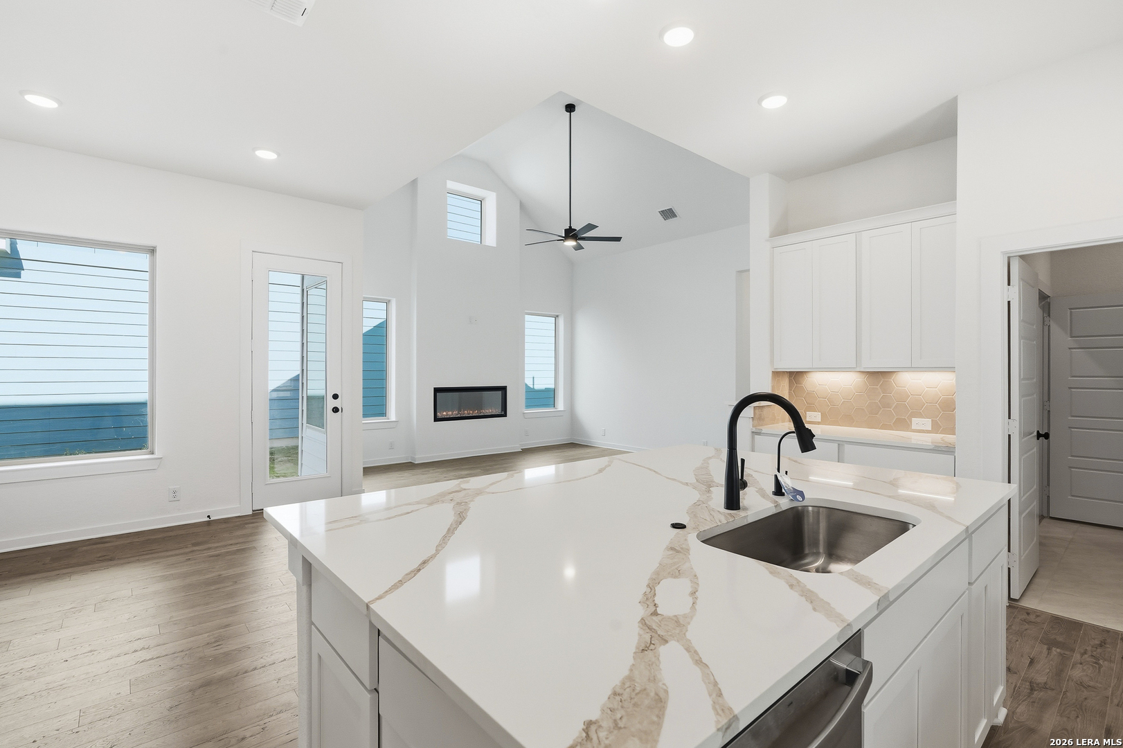 9414 Chatside Schertz, TX 78154 - Photo 14 of 37 a kitchen with kitchen island a sink appliances and a counter top space