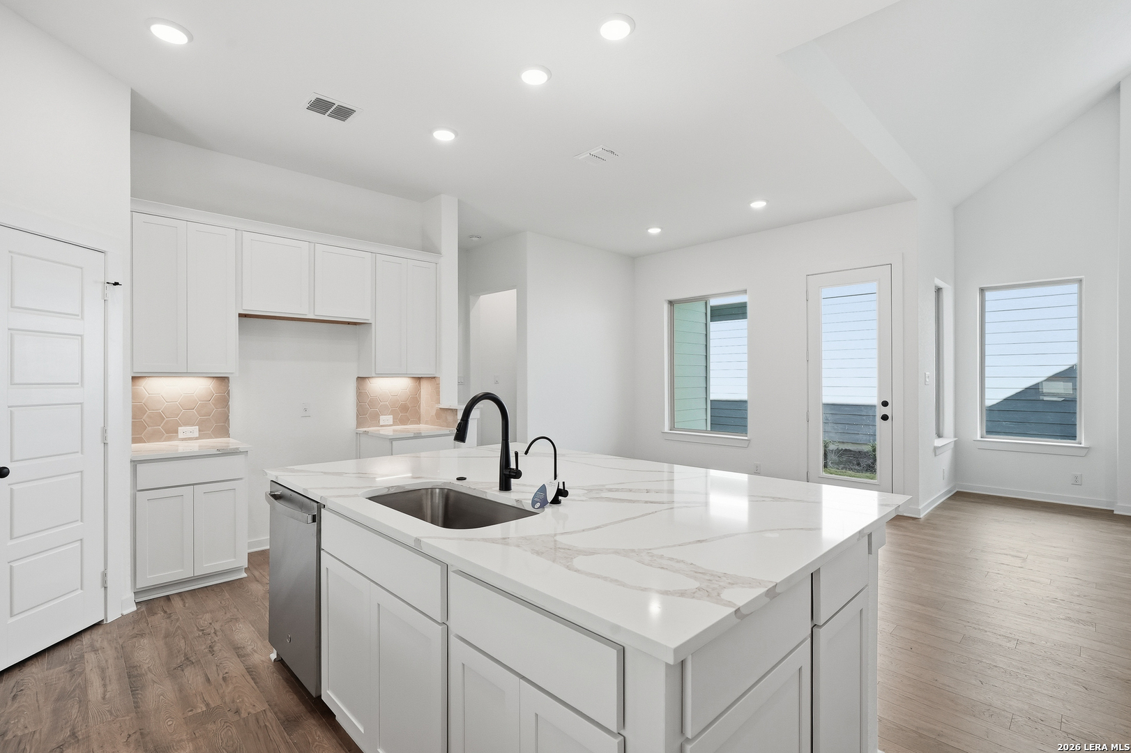 9414 Chatside Schertz, TX 78154 - Photo 15 of 37 a kitchen with a sink cabinets and wooden floor