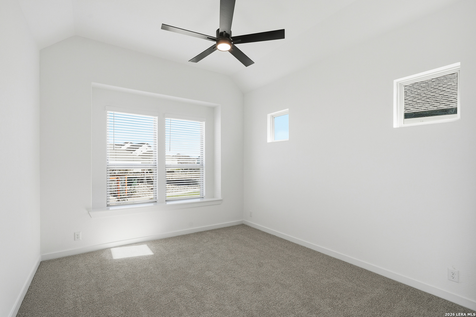 9414 Chatside Schertz, TX 78154 - Photo 21 of 37 an empty room with a window and a ceiling fan