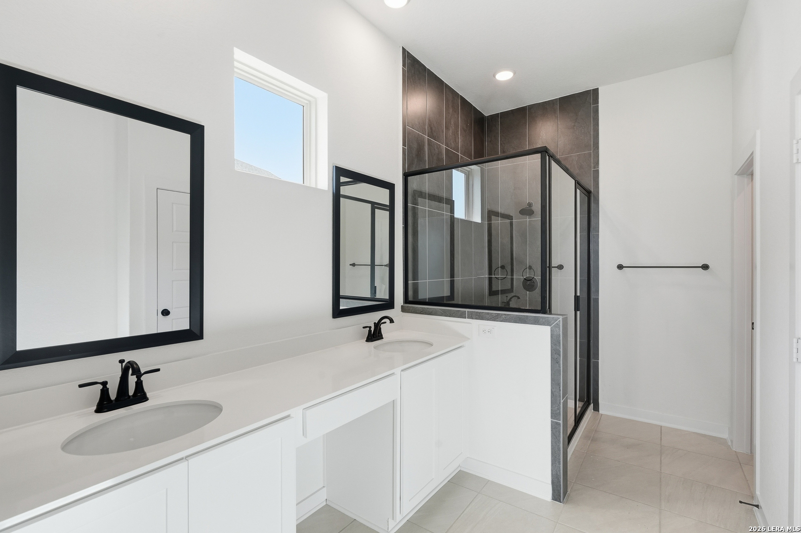 9414 Chatside Schertz, TX 78154 - Photo 23 of 37 a bathroom with double vanity sink and a mirror