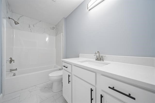 7 Bartons Rdg Road, Unit 7 Greenville, NH 03048 - Photo 11 of 28 a bathroom with a sink a toilet and shower