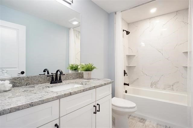 7 Bartons Rdg Road, Unit 7 Greenville, NH 03048 - Photo 13 of 28 a bathroom with a granite countertop sink toilet and shower