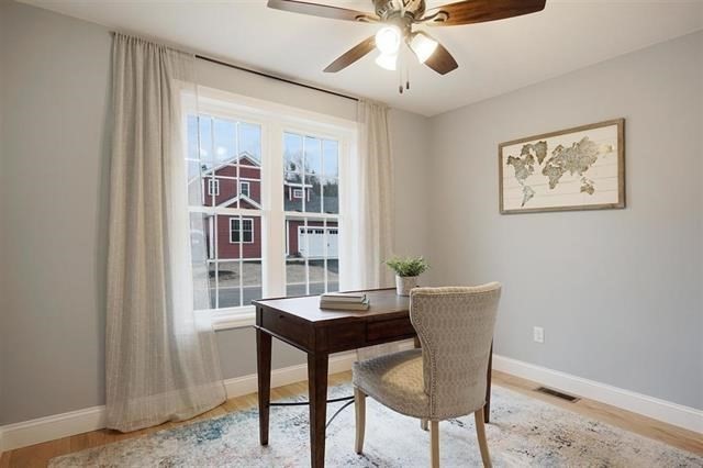 7 Bartons Rdg Road, Unit 7 Greenville, NH 03048 - Photo 3 of 28 a view of a dining room with furniture and chandelier