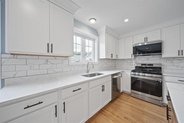 7 Bartons Rdg Road, Unit 7 Greenville, NH 03048 - Photo 6 of 28 a kitchen with a sink stove and microwave